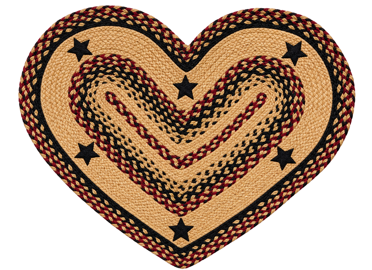Blackberry Star braided heart jute rug styled on a rustic wooden floor in a cozy primitive farmhouse entryway