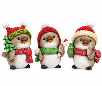Chubby glitter resin Christmas bird figurine wearing a red scarf and red and white Santa hat, holding a green present.